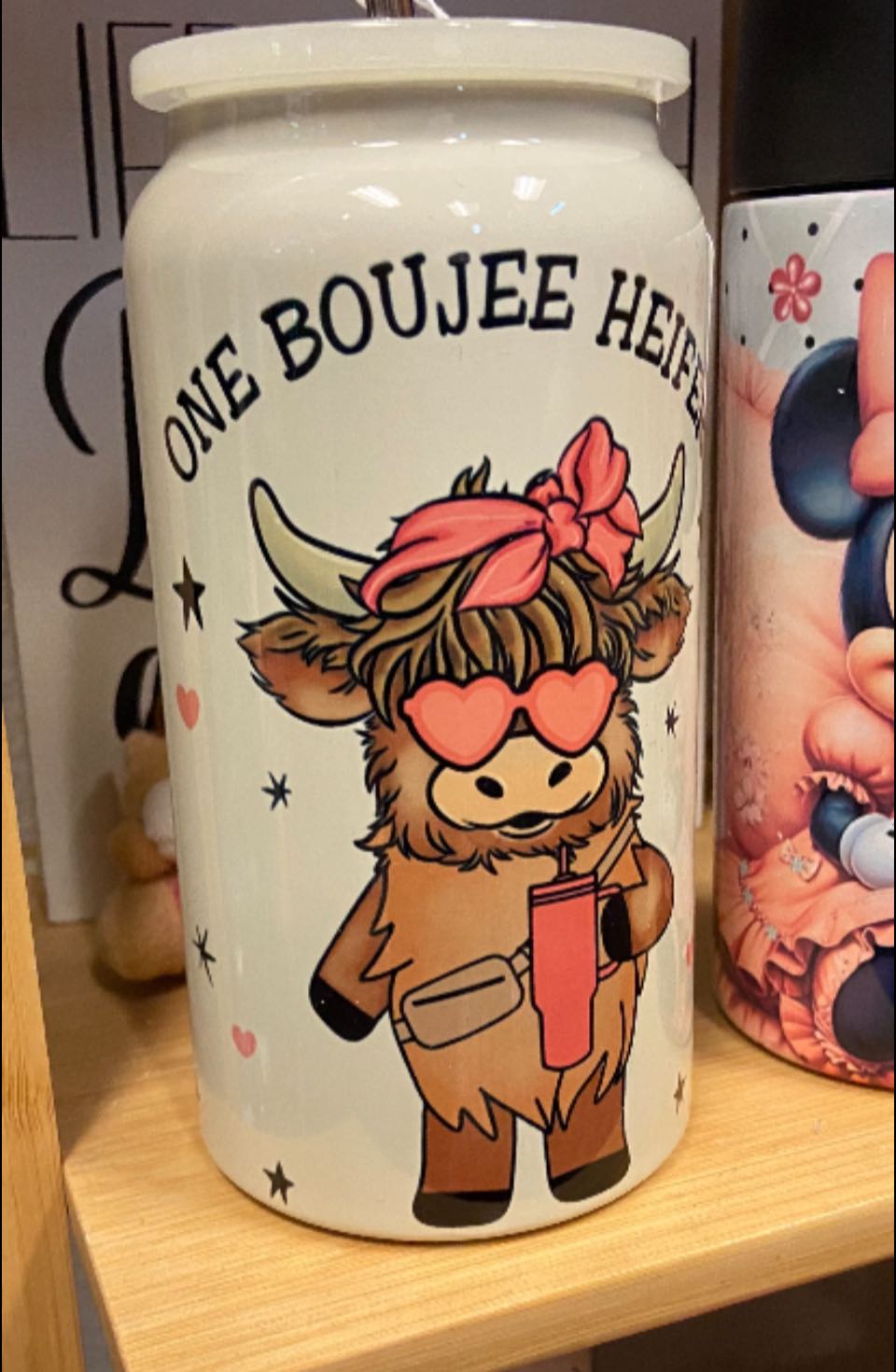 I mean… tell me this isn’t adorable. A whole boujee little heifer with her drink, her shades, her bow — living her best life on a canister.  It’s cute in person in that ‘okay fine, I kind of need it’ way.